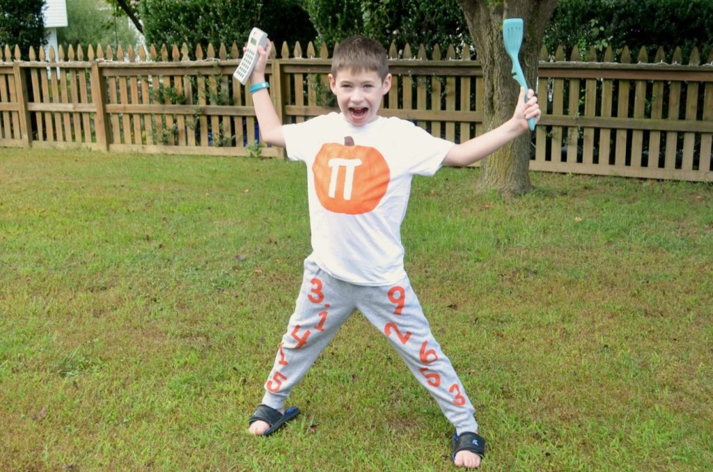 Image contains a boy wearing a Pumpkin Pi costume.