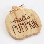 Image contains wooden pumpkin with woodburned words, "hello pumpkin".