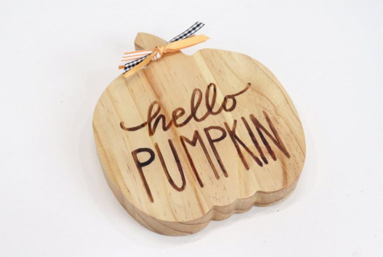 Image contains wooden pumpkin with woodburned words, "hello pumpkin".