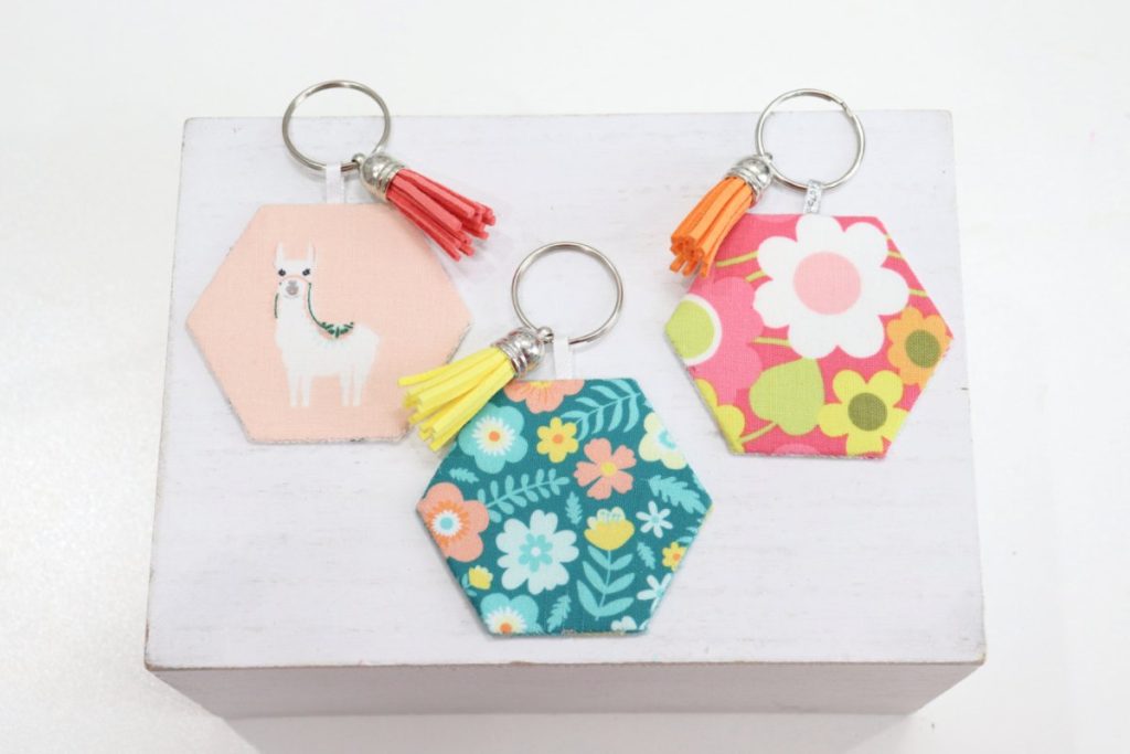 Image contains three fabric keychains on a white background.