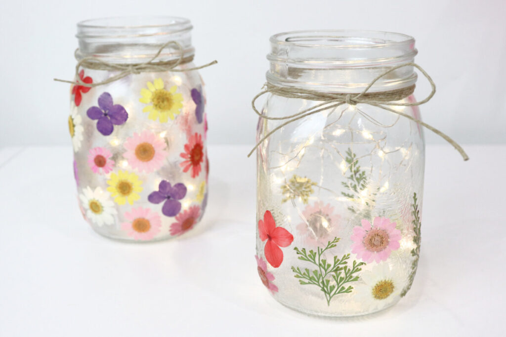 Image contains two pressed flower lanterns.