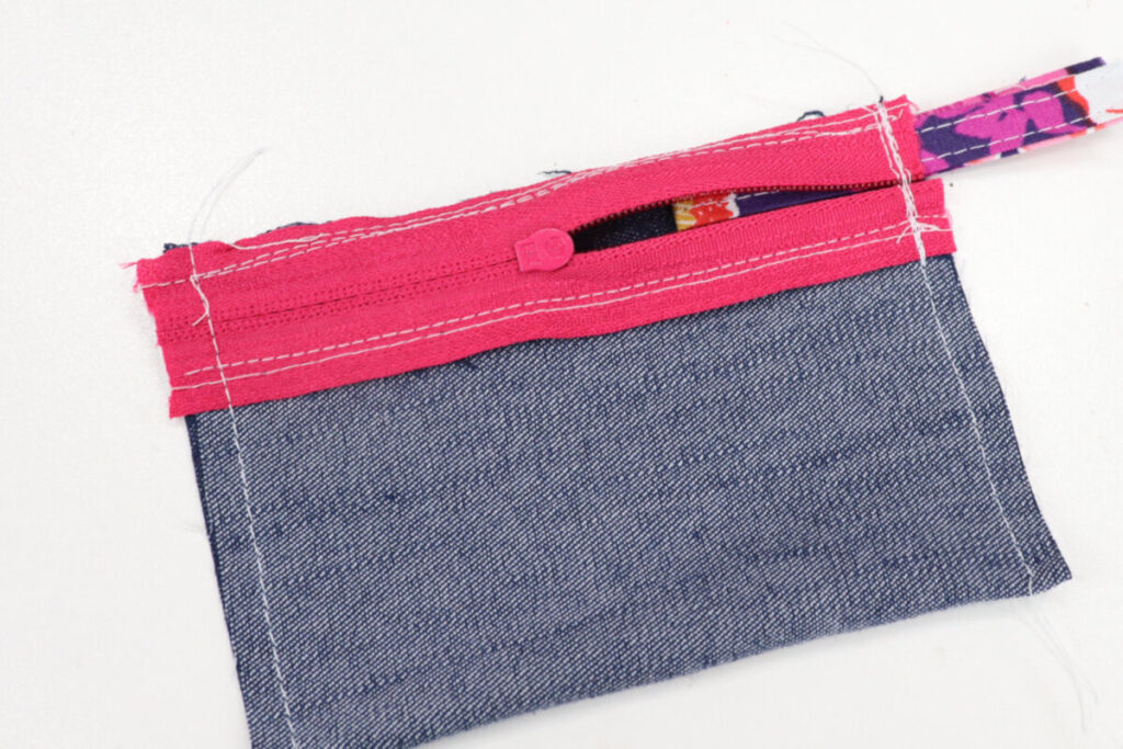 Image contains the denim tube with a vertical seam sewn on each side.
