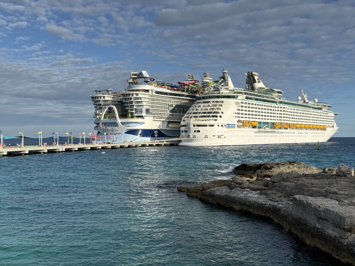 Image contains two cruise ships at port.