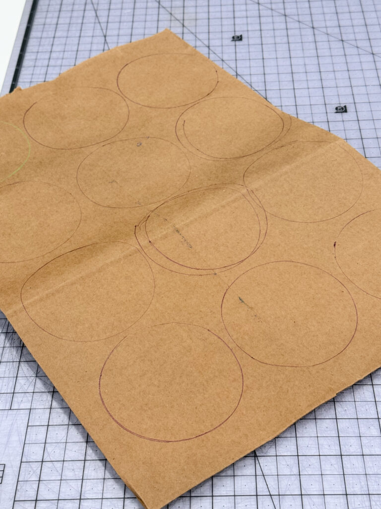 Image contains a paper grocery bag with circles drawn on it.